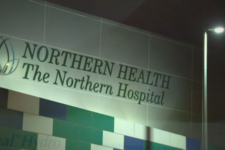 A night time shot of a sign reading 'NORTHERN HEALTH The Northern Hospital'.