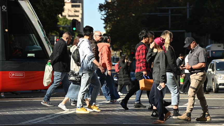 a group of people walking on a road