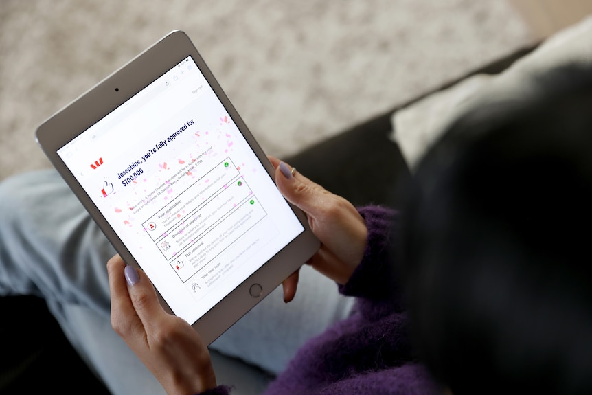 A customer using a tablet receives approval for a $700,000 mortgage on Westpac's new digital home loan platform.