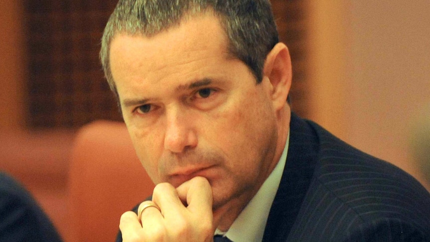 Senator Stephen Conroy listens at a cabinet meeting in Canberra. (AAP: Alan Porritt)