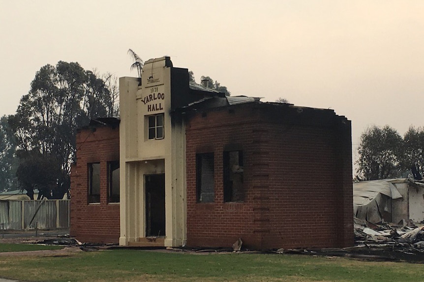 A town hall badly damaged by fire.