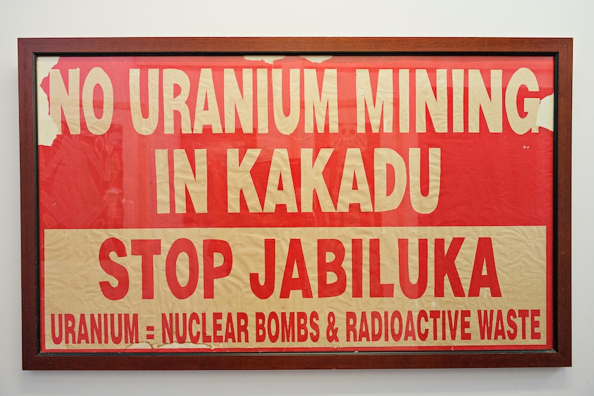 A poster in a frame saying: "No uranium mining in Kakadu. Stop Jabiluka".