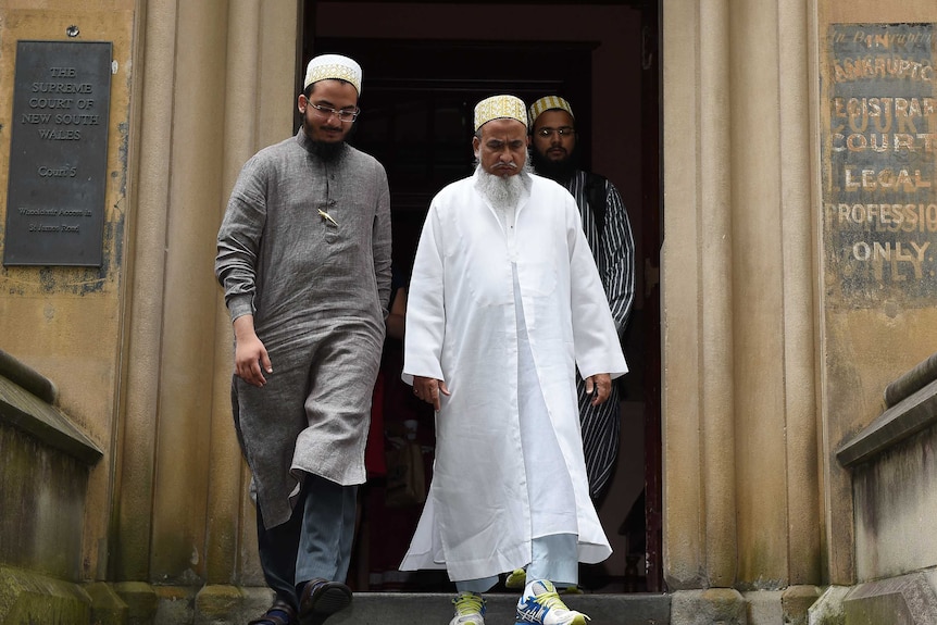 Two of the accused leaving female genital mutilation hearing in Sydney