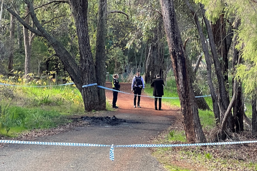 Police tape cordons off the area where the car was found.