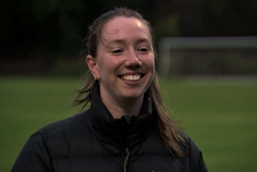 Grace Engesser smiles wearing a black jacket