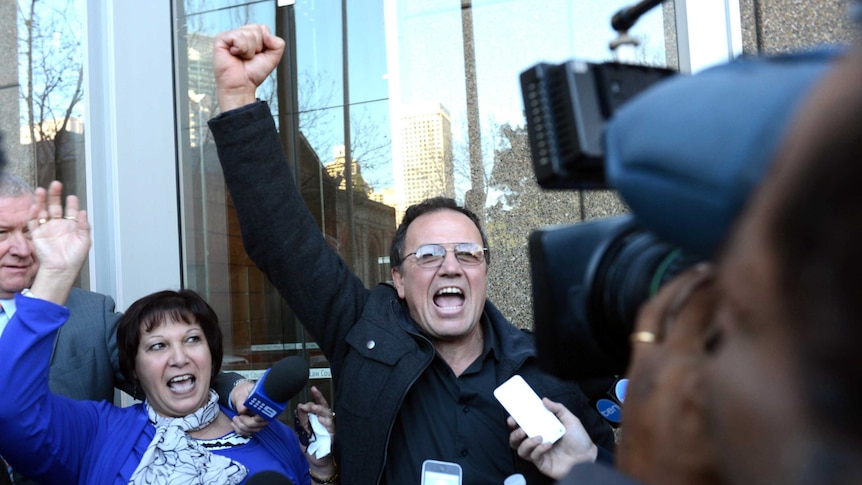 Paul and Rosie Cachia celebrate outside the Supreme Court in Sydney after Roger Dean was sentenced.