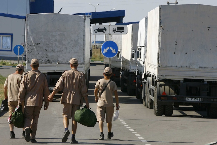 Drivers wait to leave with Russian convoy