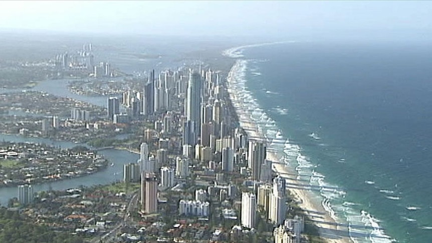 TV still of generic aerial shot of Gold Coast beachfront, ocean, buildings and inner streets