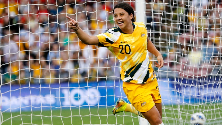 Soccer player celebrates after scoring a goal during a match