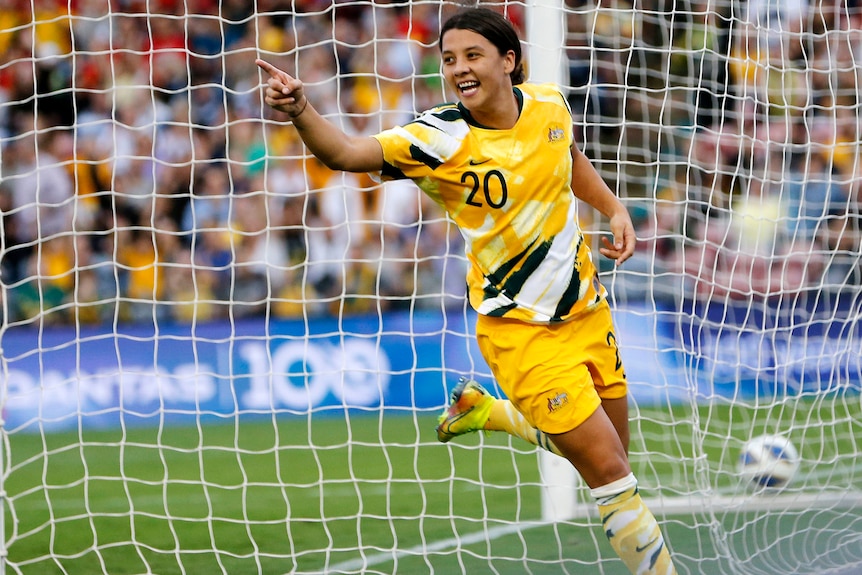 Soccer player celebrates after scoring a goal during a match