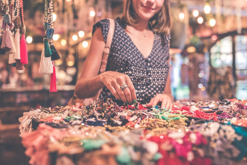 Woman sifting through jewellery 