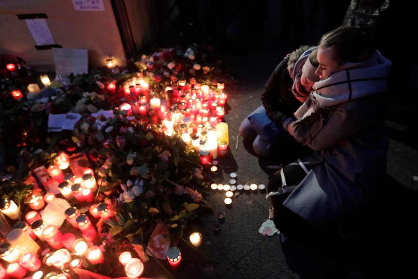 Mourners gather at candlelight vigil in Berlin