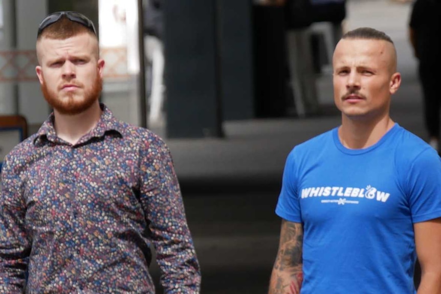 James Warden and co-accused Arkadiusz Swiebodzinski stand on a street corner in Perth as they return to trial.