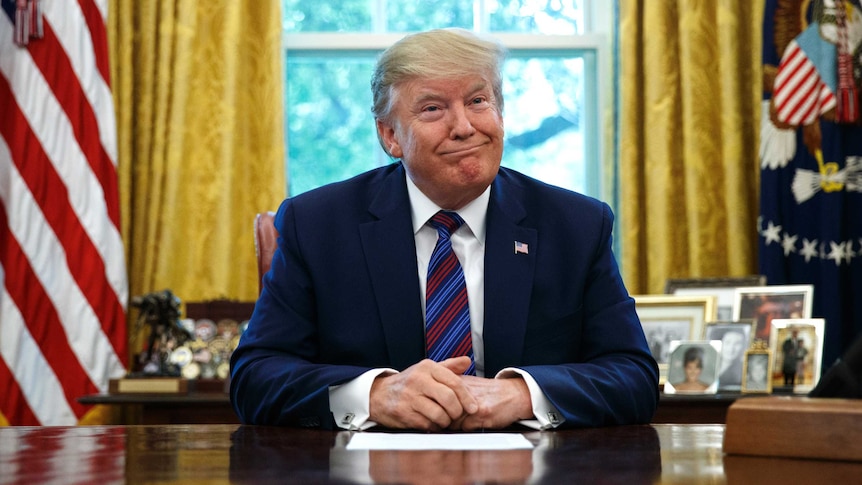 President Donald Trump pauses as he speaks in the Oval Office of the White House in Washington