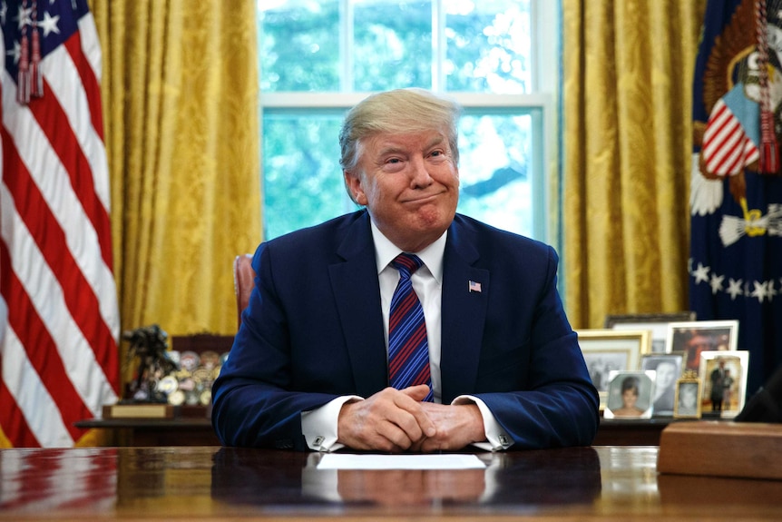 President Donald Trump pauses as he speaks in the Oval Office of the White House in Washington