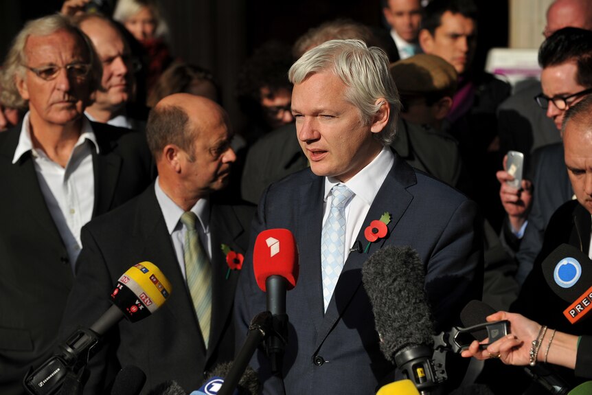 WikiLeaks founder Julian Assange speaks to the waiting media upon leaving London's High Court