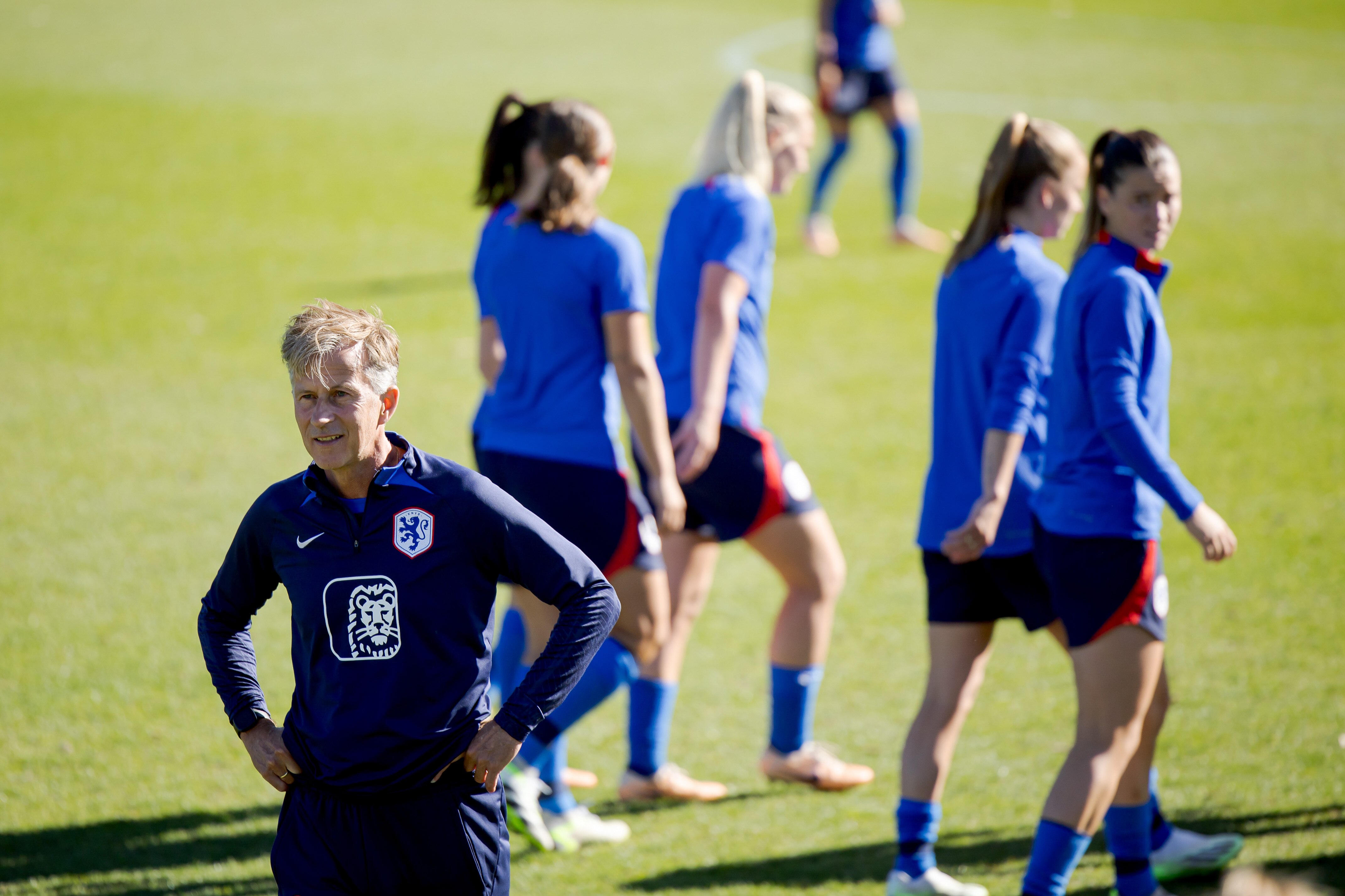 A man looks on as his players train.
