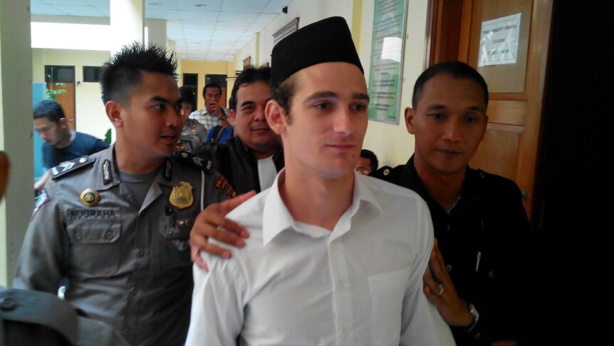 Jake Drage is led away from a Sukabumi courthouse.