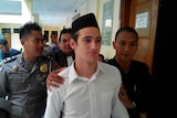 Jake Drage is led away from a Sukabumi courthouse.