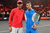 Rafael Nadal and Carlos Alcaraz pose together for a photo at an exhibition tournament.