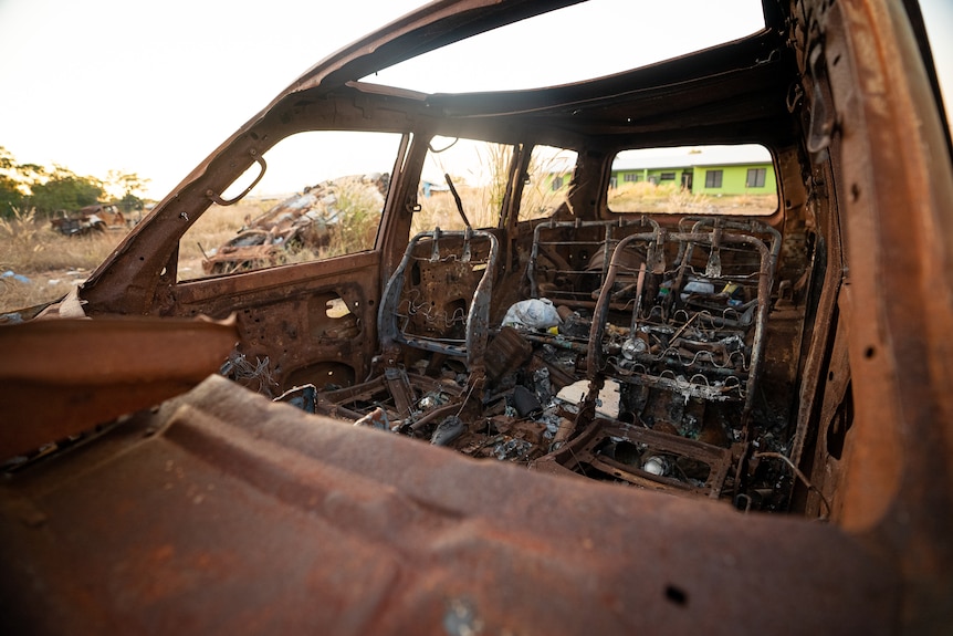 The inside of a burnt out car.