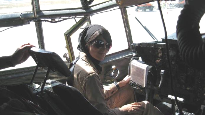 A picture of Captain Niloofar Rahmani in a cockpit.