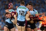 Brent Tate of the Maroons is tackled in Origin game two against New South Wales on June 18, 2014.