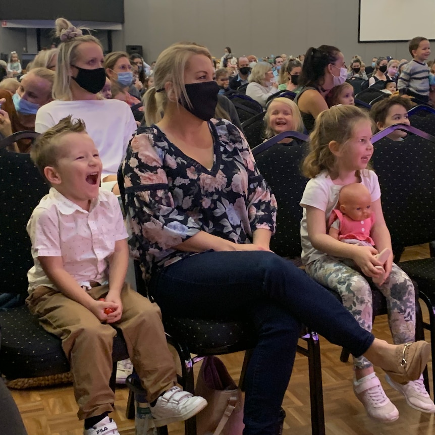 Crowd featuring smiling children sitting watching Playschool live show in RSL auditorium