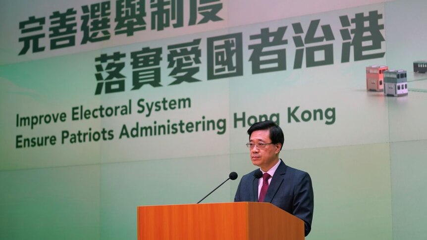 Hong Kong government official John Lee at a press conference on candidate eligibility for parliamentary elections