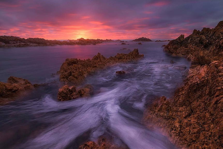 A sunset over the shoreline at Kings Run.