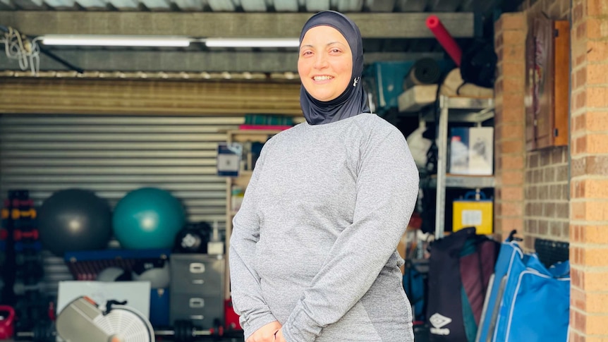 Linda Berjaoui stands within her Isabella Plains garage gym.