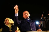 Turkey's President Recep Tayyip Erdogan waves to supporters in Istanbul.