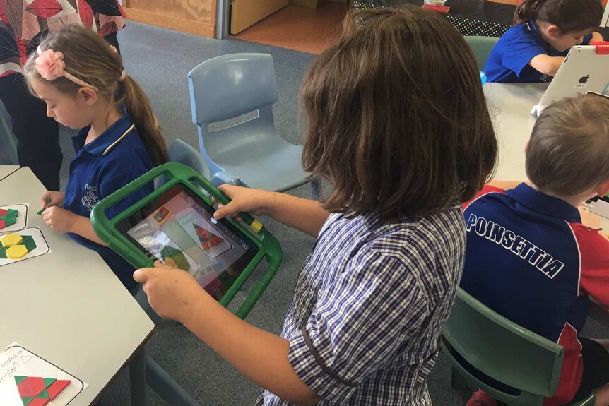 A Prep student at Oakleigh State School on an iPad