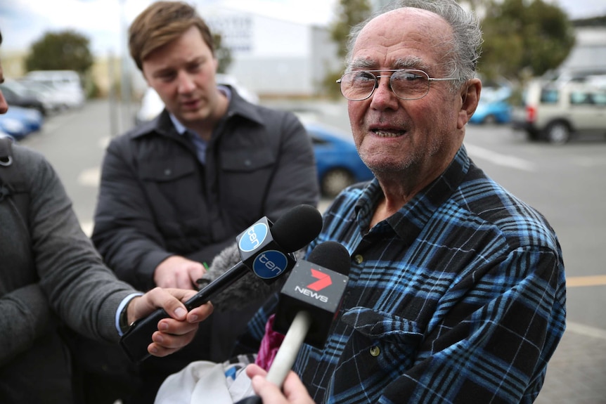 Mr Johnston speaks with the media.