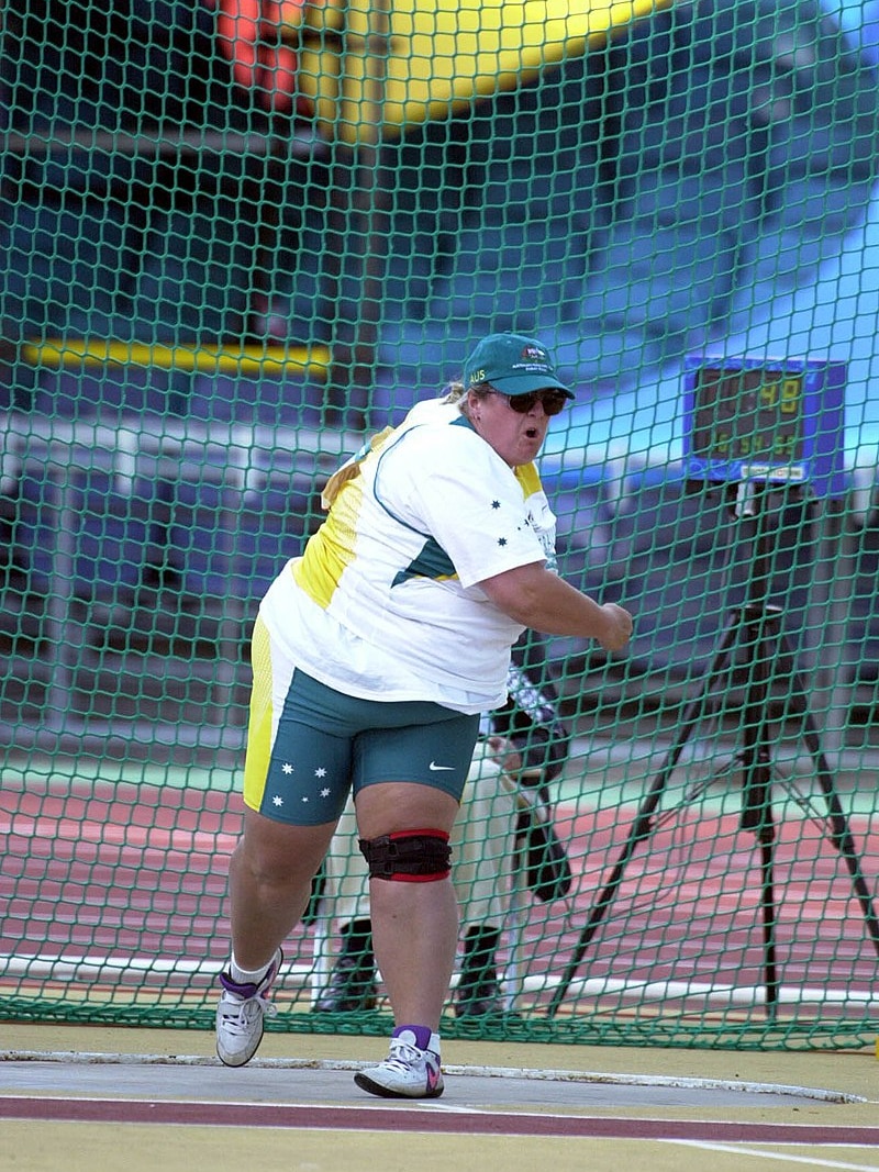 A woman competes in the shot put at the Paralympics.