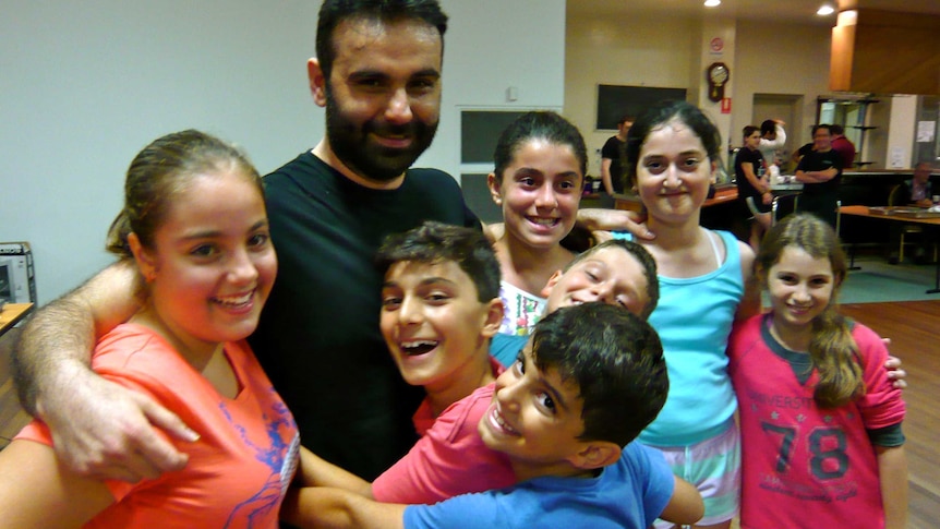 Junior dancers, including Antionio Arvanitagis (front) and Yianni Babousis (second from left) farewell Gianni Megalakakis