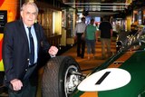 Sir Jack Brabham stands next to his Repco Brabham BT19 when it was on display at the National Sport Museum.