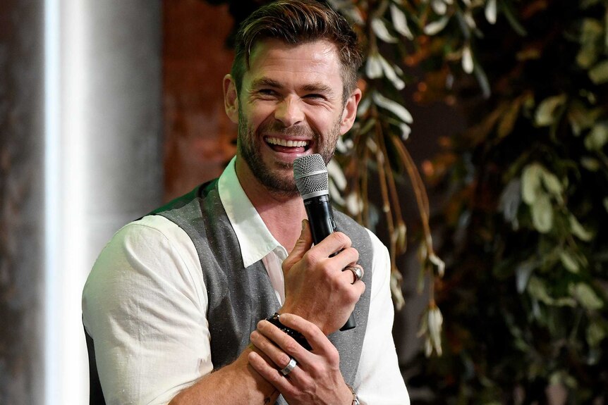 Chris Hemsworth laughs while presenting at the Tourism Australia launch.