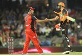 Aaron Finch (L) shakes hands with Ashton Turner (R) after Perth Scorchers beat Melbourne Renegades.