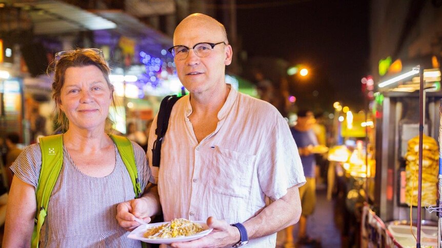 Swedish tourists Catarina and Sacke Jacobsson stop by a stall on the famous strip.