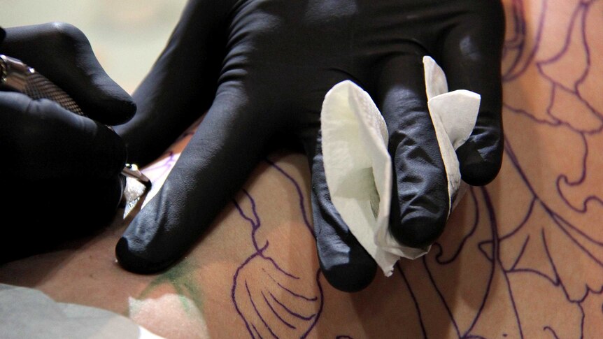 Queensland Fair Trading and police are assessing applications for tattoo industry licences.