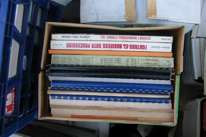 A box of computer manuals.