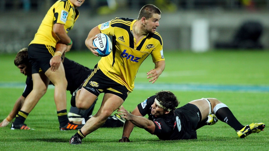 Dane Coles makes his way through the porous Sharks defence.