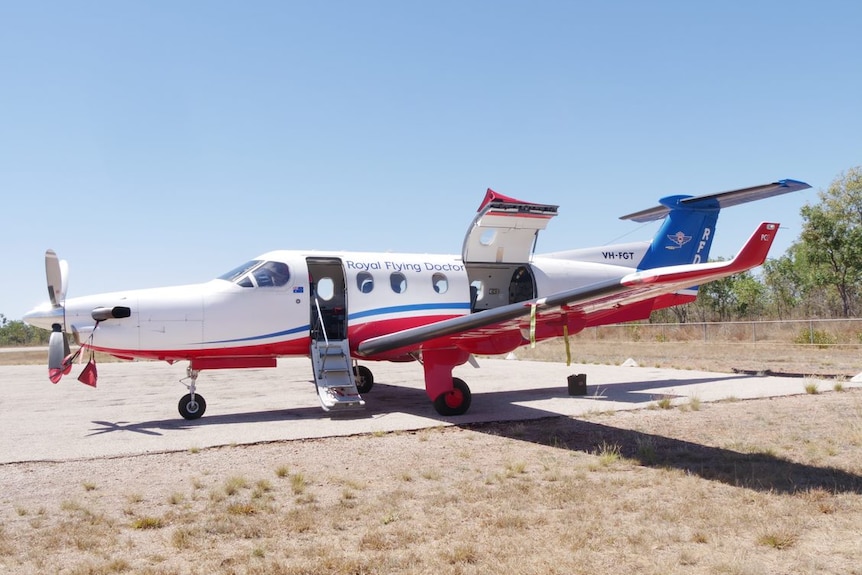 A photo of a small plane on a remote airstrip