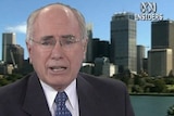 John Howard says there are problems with freezing debt repayments. (File photo)