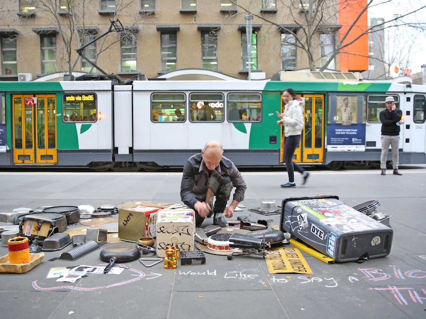 Melbourne busker Paul Guseli on the corner of Bourke and Swanston Streets.