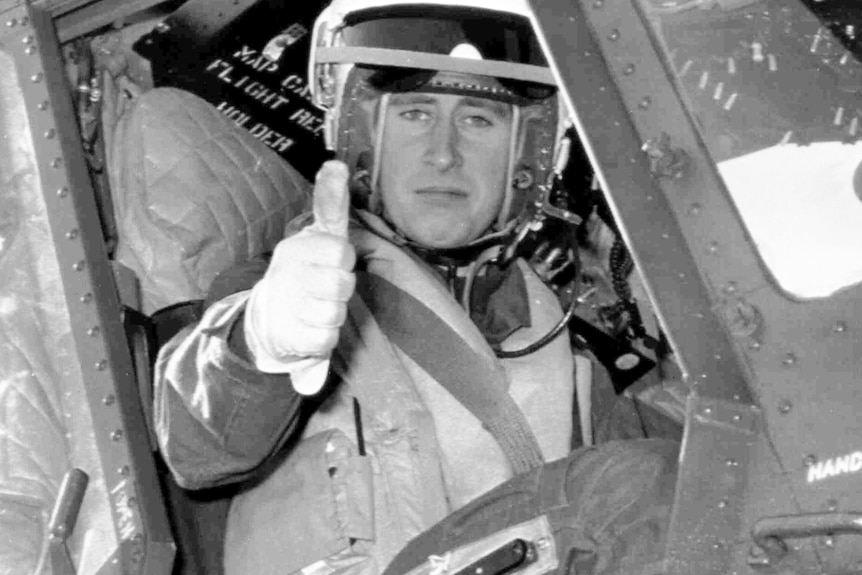 A black and white photo of Prince Charles on a training flight from Yeovilton Royal Navy Air Station in 1972.