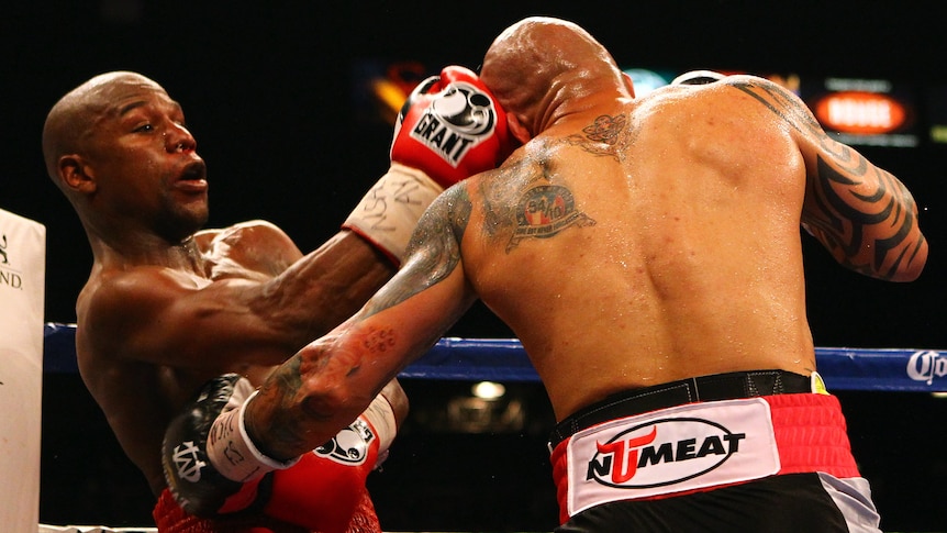 Tough going ... Floyd Mayweather lands a right on Miguel Cotto on his way to a 12-round victory.