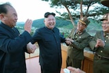 Kimg Jong-un celebrates after the missile launch on May 14, 2017.