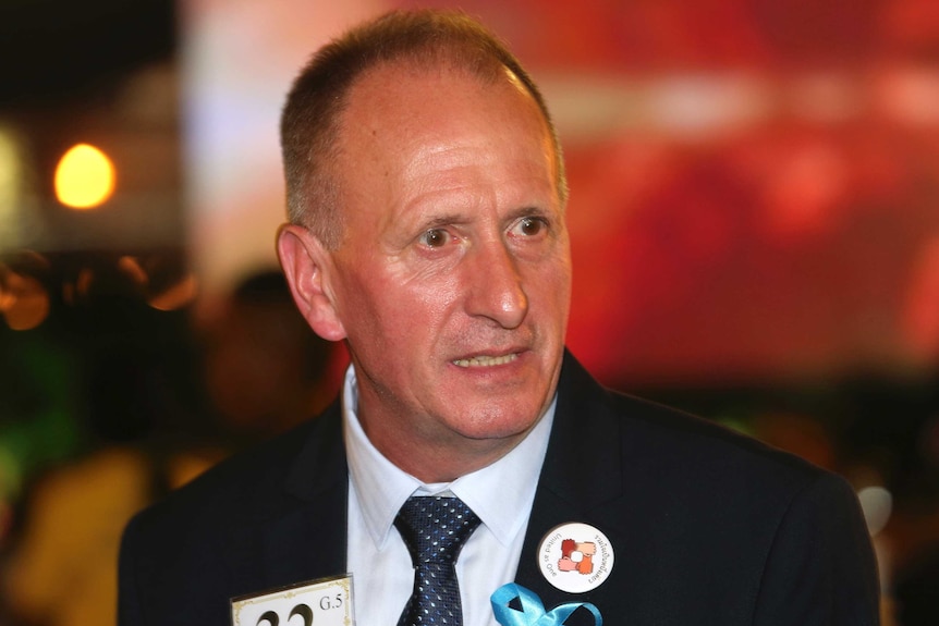 A head and shoulders shot of Vernon Unsworth wearing a suit jacket and tie.